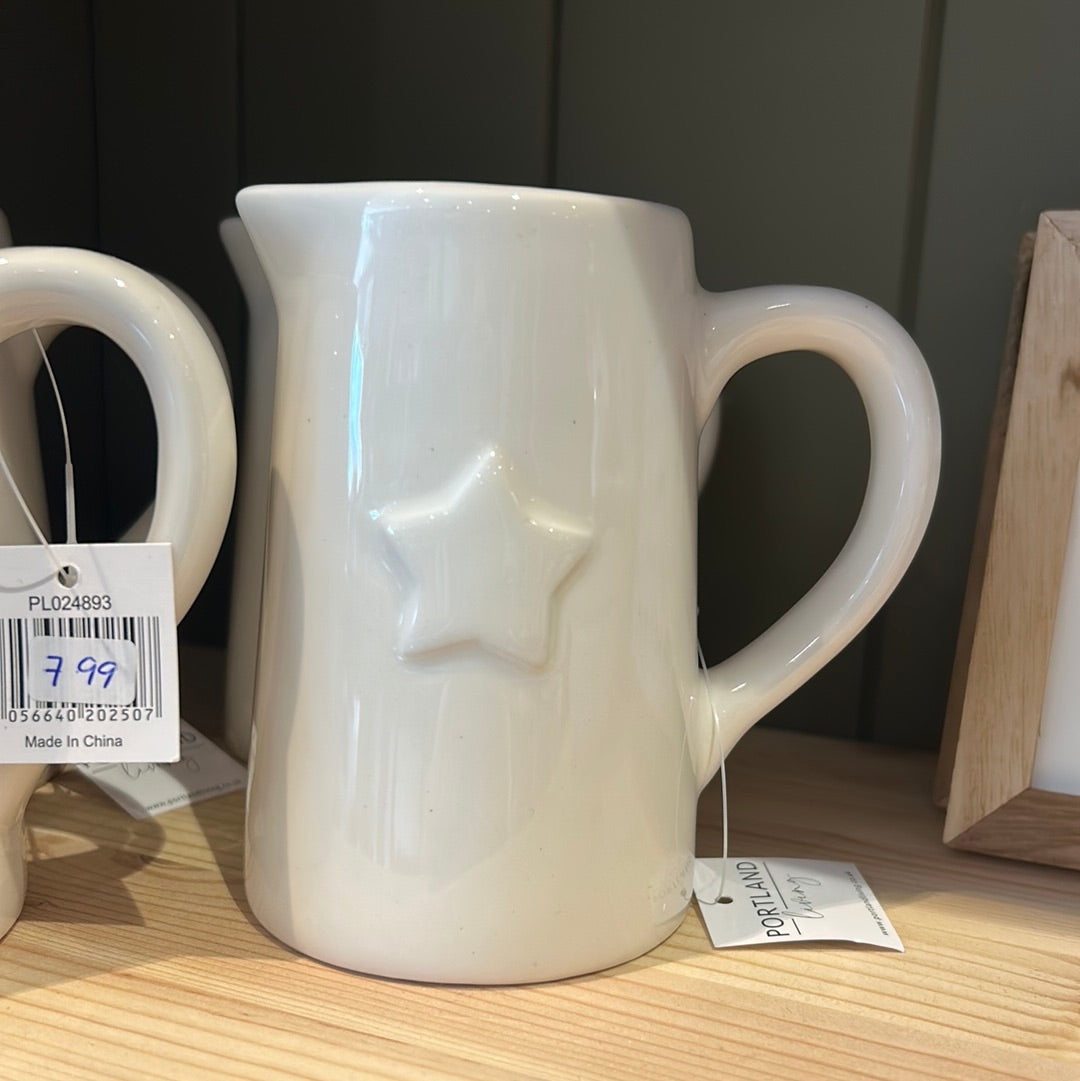 Small white jug with star