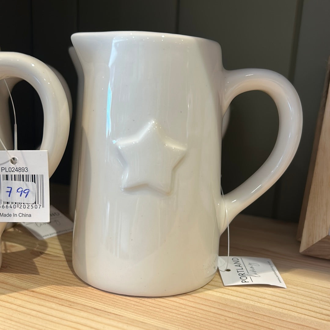 Small white jug with star
