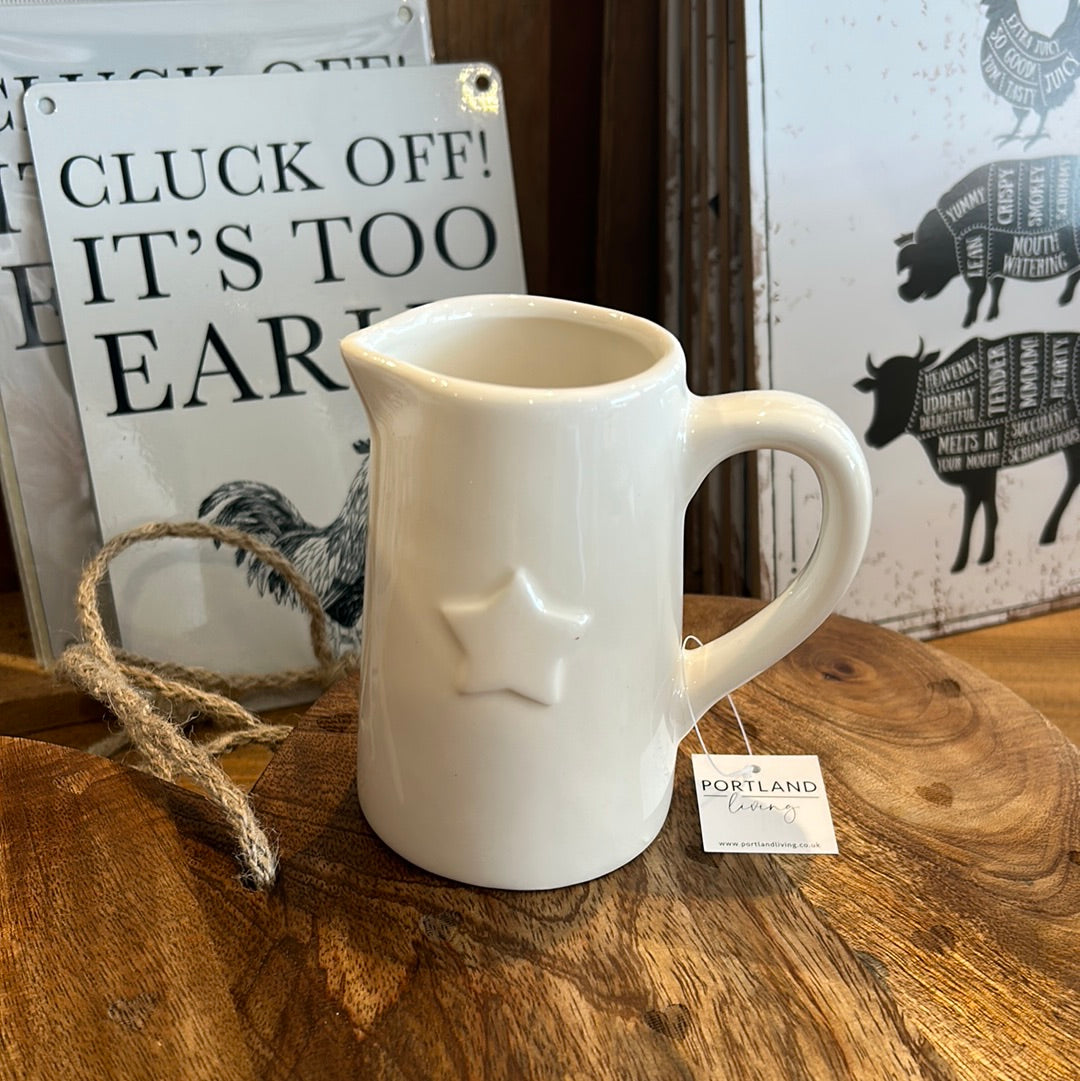 Small white jug with star